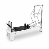 Bodylumina Platinum crni pilates tower reformer s bež kliznom platformom, metalnim tornjem, oprugama, podesivim trakama i footbar osloncem, profesionalna pilates sprava za tower reformer trening, jačanje core mišića, istezanje, stabilnost, rehabilitaciju i oblikovanje tijela kod kuće ili u studiju.