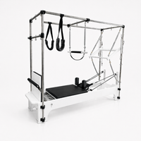 Bodylumina Premium Platinum pilates Cadillac reformer s bijelom konstrukcijom, crnom kliznom platformom, metalnim tornjem, oprugama, trakama i visećim dodacima, profesionalna pilates sprava za kompletan reformer i Cadillac trening, istezanje, jačanje core mišića, stabilnost, rehabilitaciju i oblikovanje tijela kod kuće ili u studiju.
